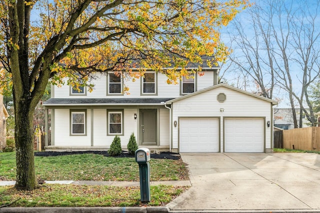 view of front of house featuring a garage and a front yard