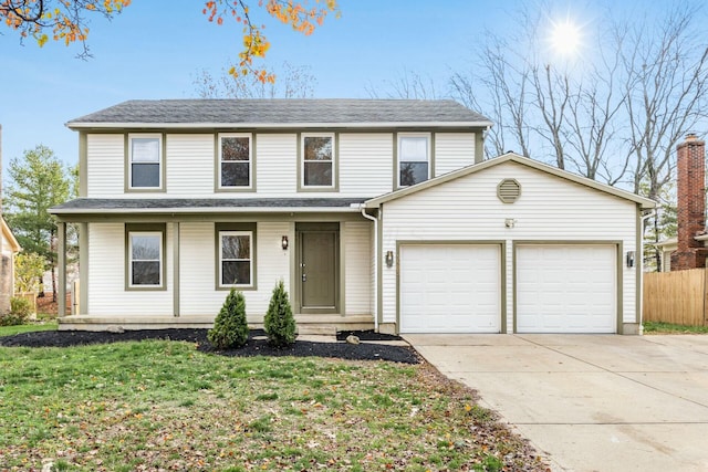 front of property with a garage and a front yard