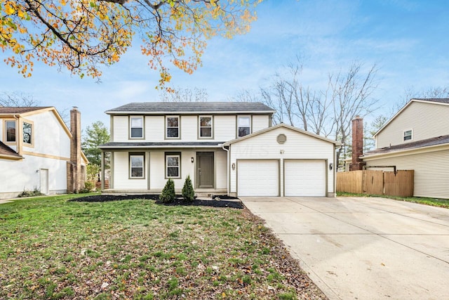 front facade featuring a garage and a front lawn