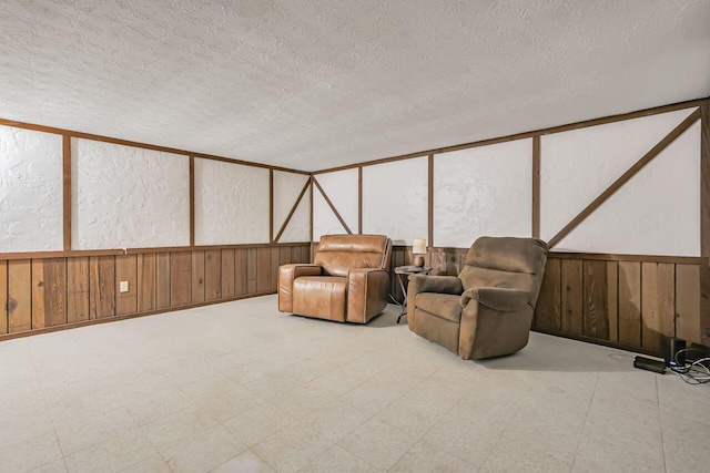 home theater room featuring a textured ceiling