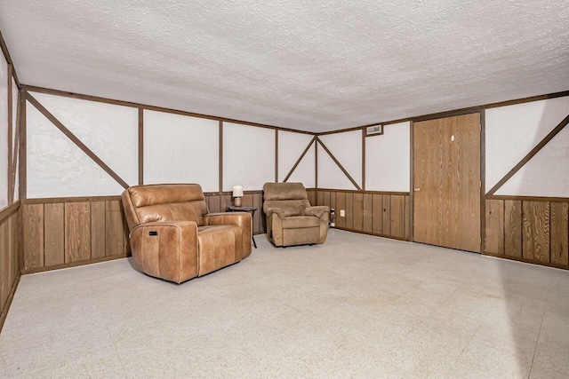 sitting room with a textured ceiling