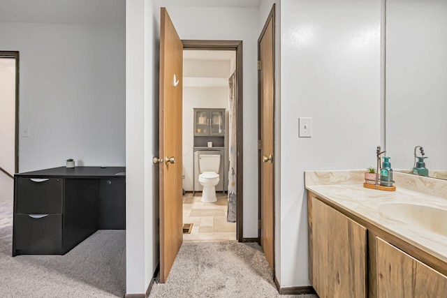 bathroom with vanity and toilet