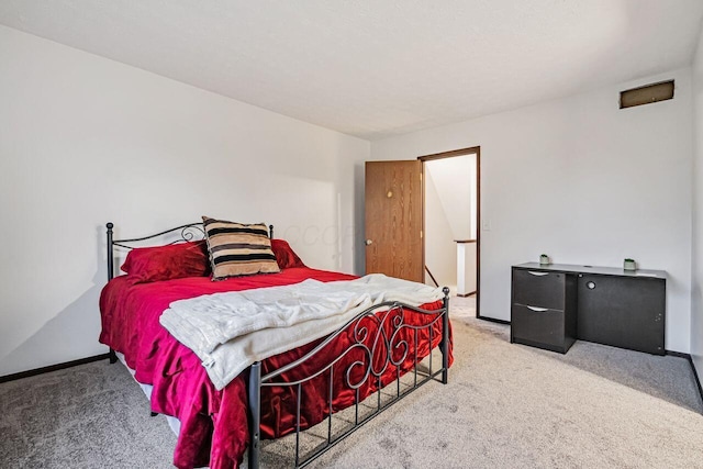 bedroom featuring light colored carpet