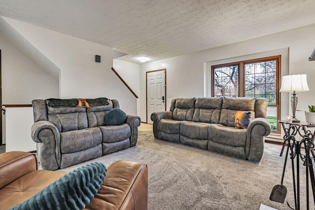 carpeted living room with a textured ceiling