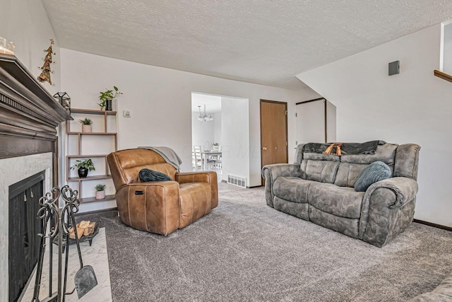 living room featuring light colored carpet and a textured ceiling