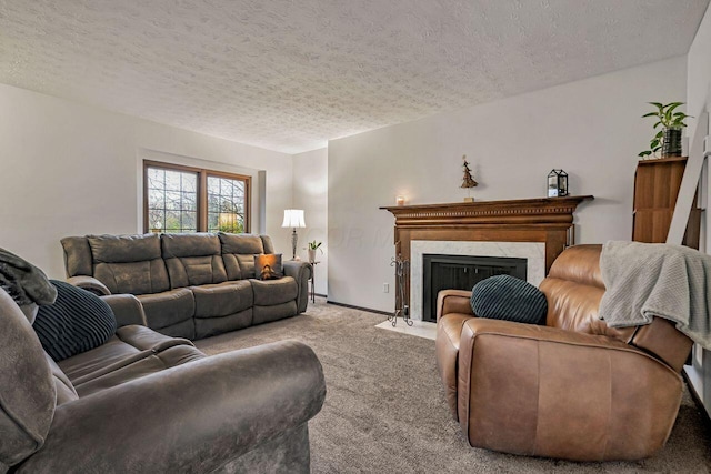 carpeted living room with a high end fireplace and a textured ceiling