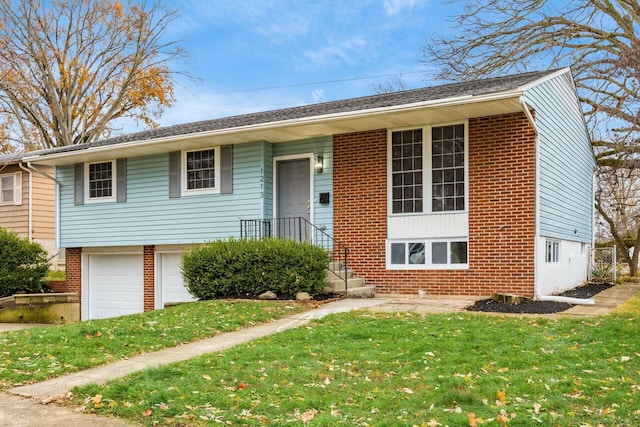 view of front facade with a garage and a front lawn