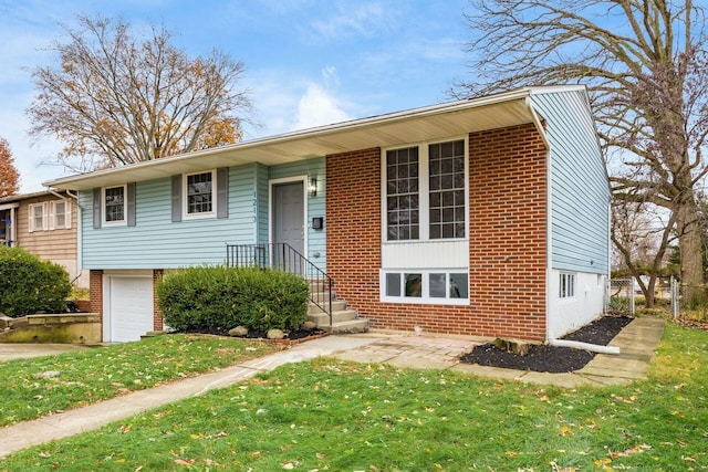 view of front of home with a garage and a front yard