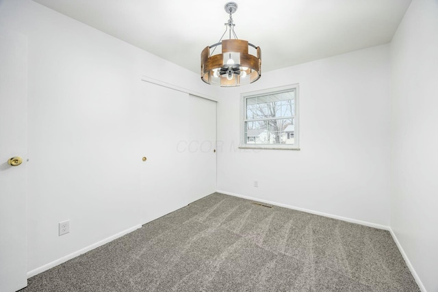 spare room featuring carpet floors