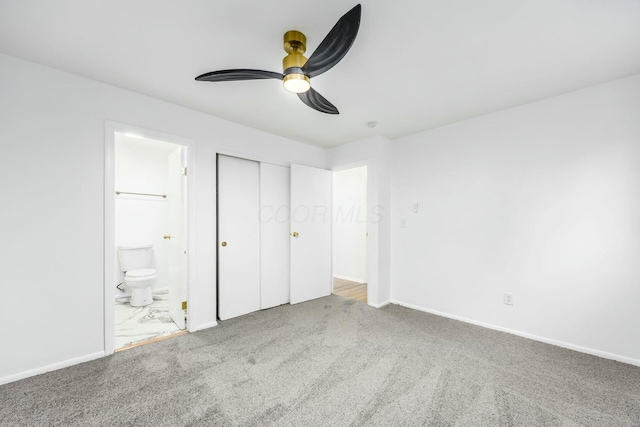 unfurnished bedroom with carpet flooring, connected bathroom, ceiling fan, and a closet