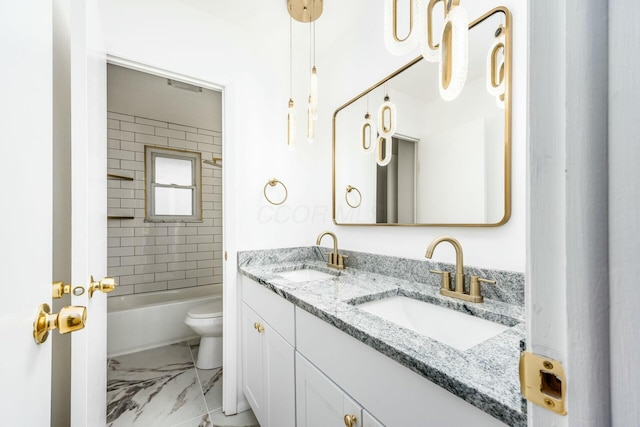 full bathroom with vanity, toilet, and tiled shower / bath