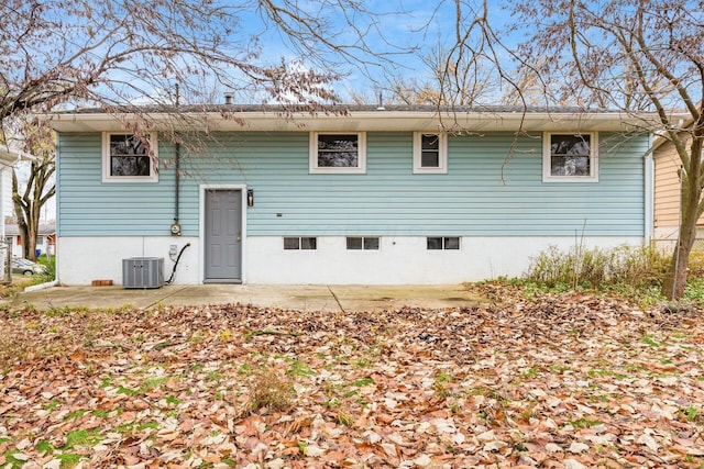 back of property with a patio area and central air condition unit