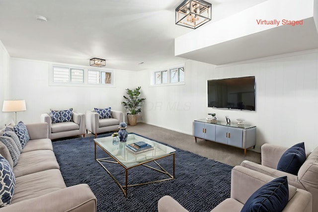 living room with carpet and a healthy amount of sunlight