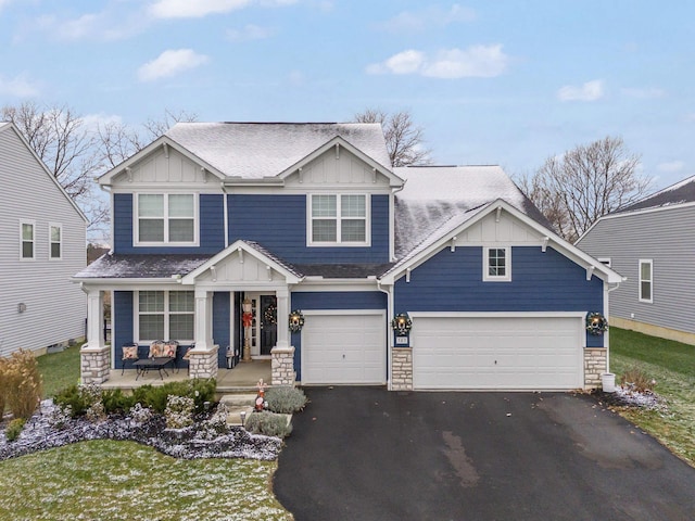 craftsman-style house featuring a garage and covered porch