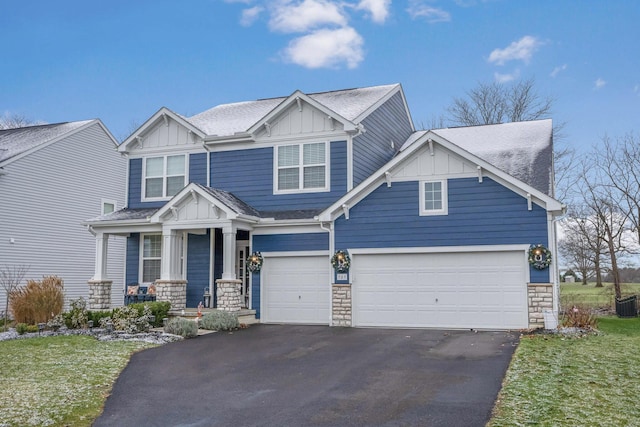 craftsman-style home featuring covered porch and a garage