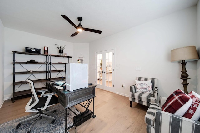 office space featuring ceiling fan, light wood-type flooring, and french doors