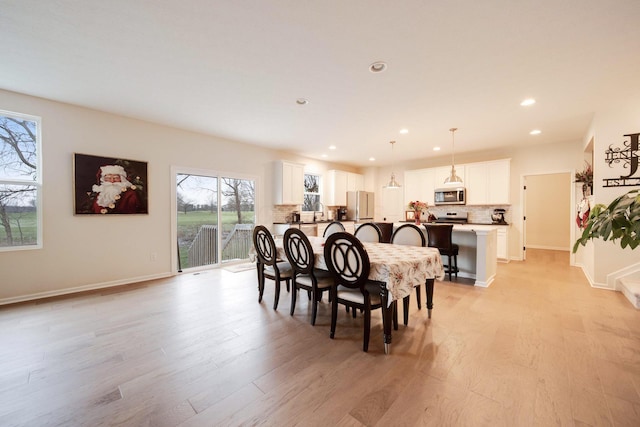 dining space featuring light hardwood / wood-style flooring