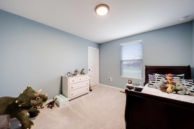 bedroom with light colored carpet