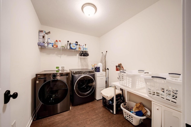 washroom with washing machine and dryer and wood-type flooring