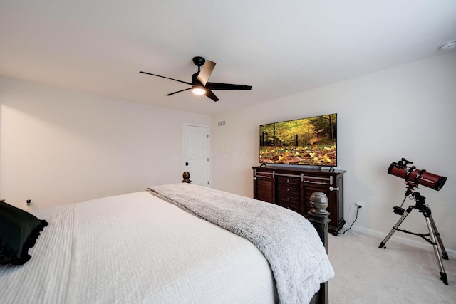 bedroom featuring ceiling fan and light carpet