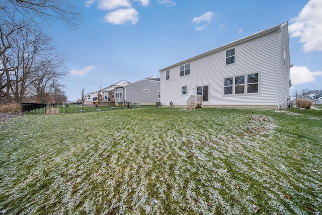 rear view of house with a lawn