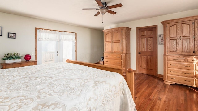 bedroom featuring ceiling fan, dark hardwood / wood-style flooring, and french doors