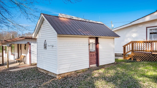 view of outbuilding featuring a yard