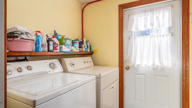 washroom with washing machine and clothes dryer