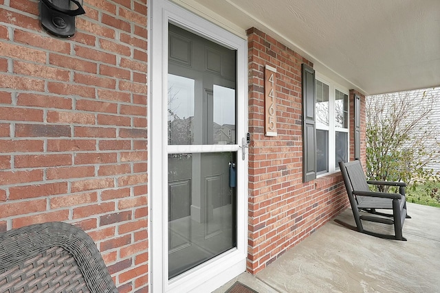 doorway to property featuring covered porch