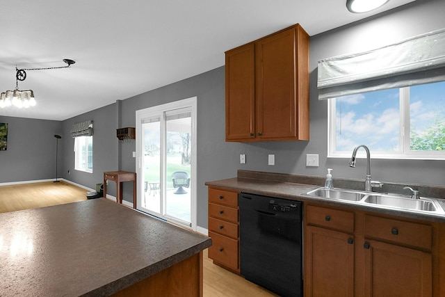 kitchen with dishwasher, light hardwood / wood-style floors, a wealth of natural light, and sink