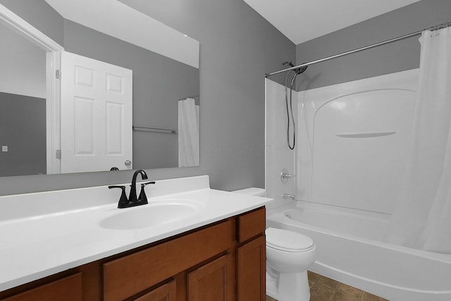 full bathroom featuring vanity, shower / bath combo, and toilet