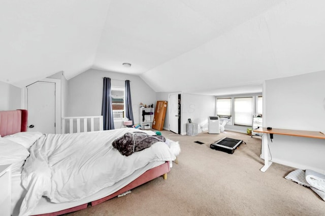 bedroom with carpet and lofted ceiling