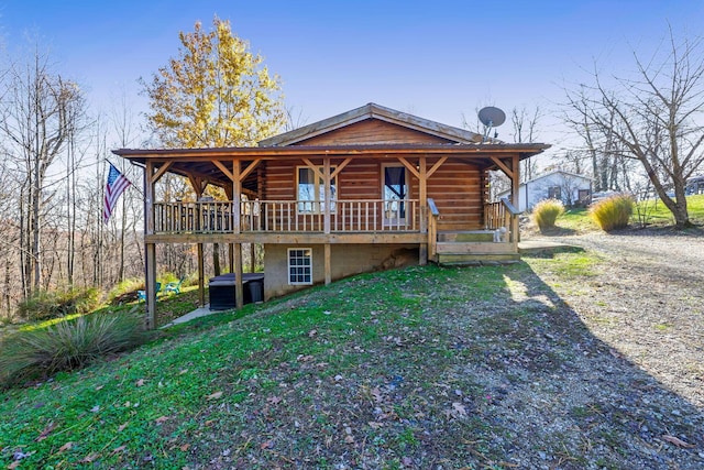 view of front of house featuring a front yard and central AC