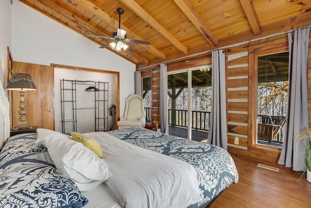 bedroom with ceiling fan, vaulted ceiling with beams, hardwood / wood-style floors, access to outside, and wood ceiling