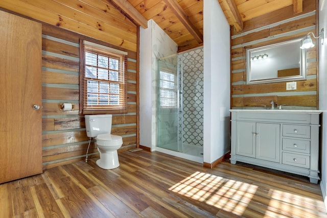 bathroom with wood-type flooring, lofted ceiling with beams, and wooden walls