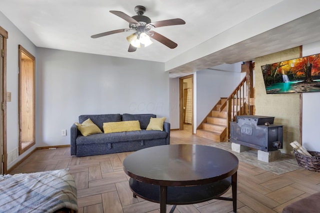 living room with ceiling fan and light parquet floors