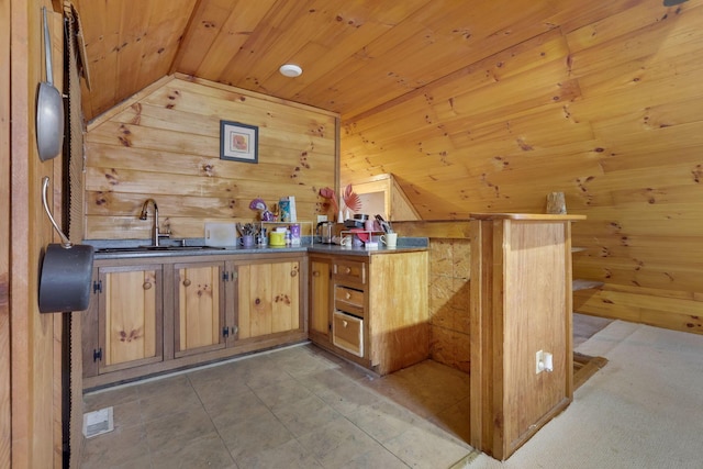 bar with wood walls, sink, wooden ceiling, and lofted ceiling