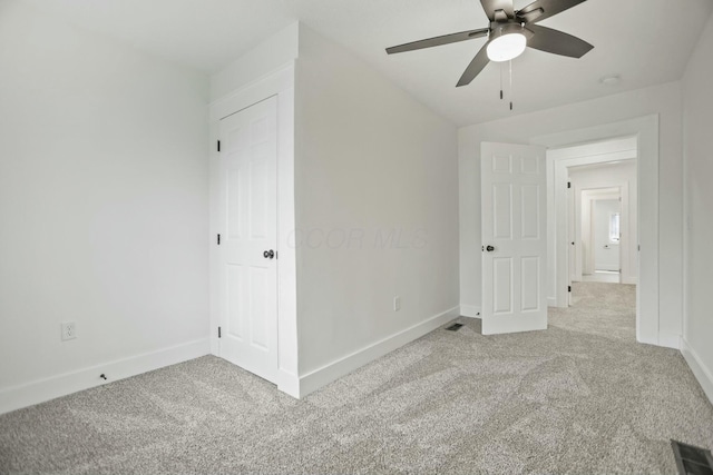 unfurnished bedroom with light carpet and ceiling fan