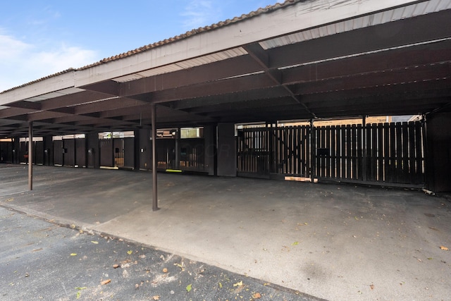 view of vehicle parking with a carport