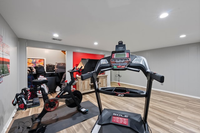 workout room with wood-type flooring