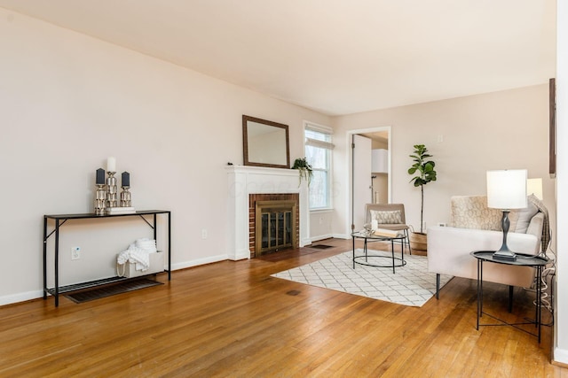 living room with a fireplace and hardwood / wood-style flooring