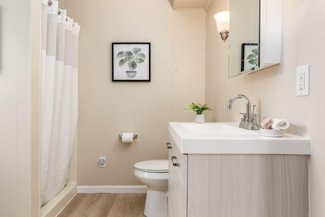 bathroom with vanity, curtained shower, toilet, and wood-type flooring