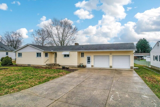 ranch-style home with a front yard and a garage