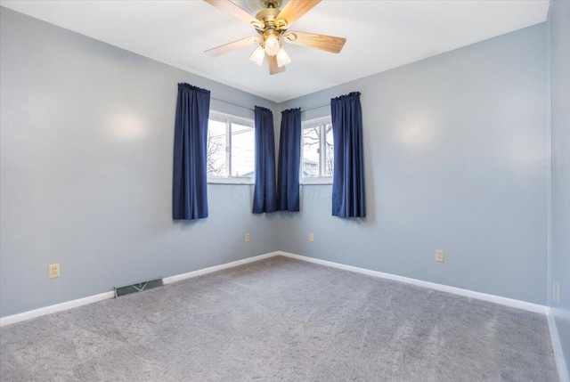 unfurnished room with carpet flooring and ceiling fan