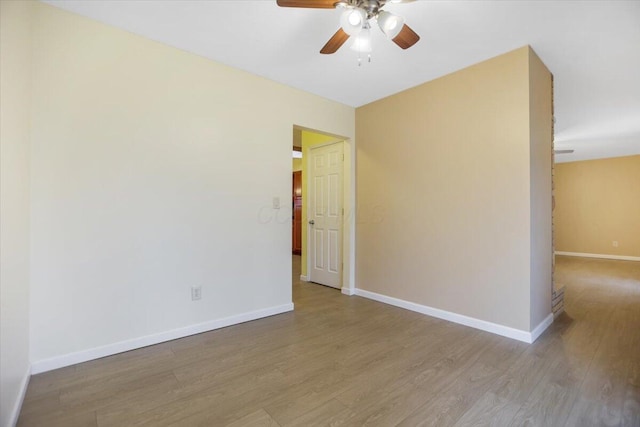 spare room with ceiling fan and light hardwood / wood-style floors