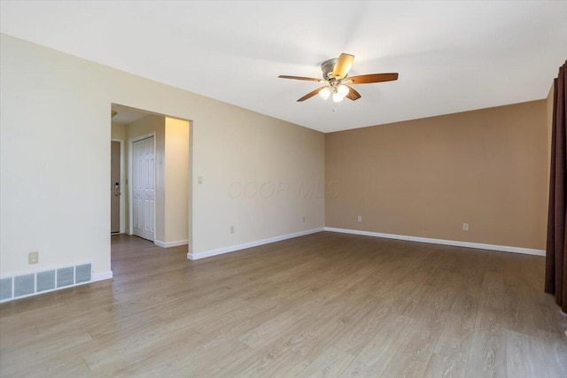 unfurnished room featuring light hardwood / wood-style flooring and ceiling fan