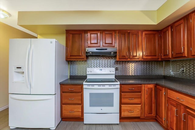 kitchen with backsplash, light hardwood / wood-style flooring, and white appliances