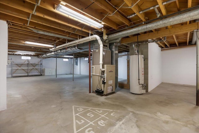 basement featuring gas water heater and heating unit