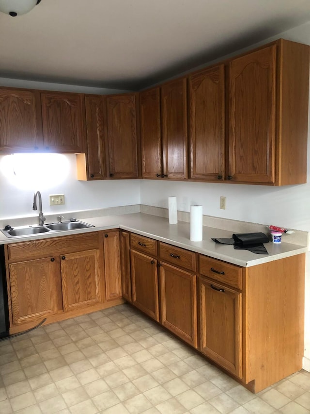 kitchen with black dishwasher and sink