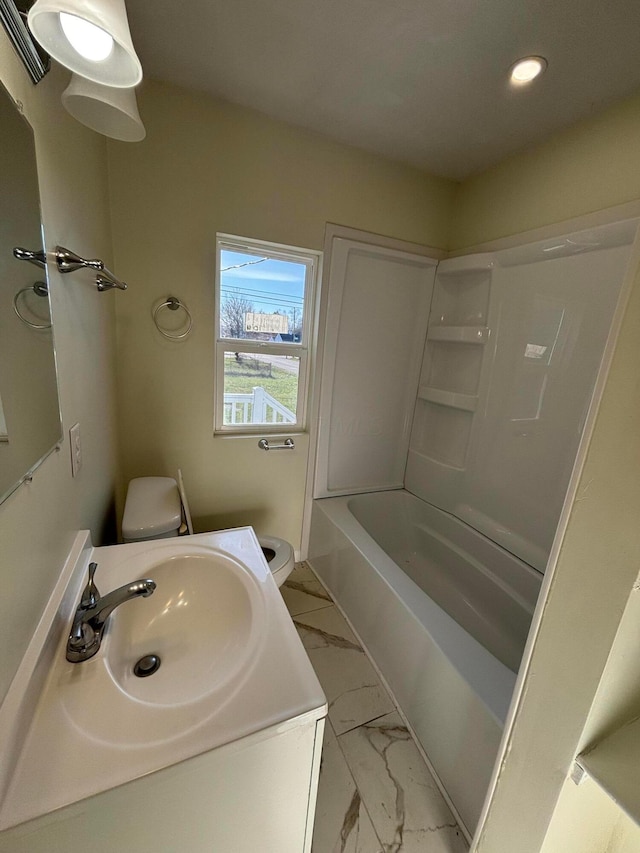 full bathroom featuring shower / bath combination, vanity, and toilet